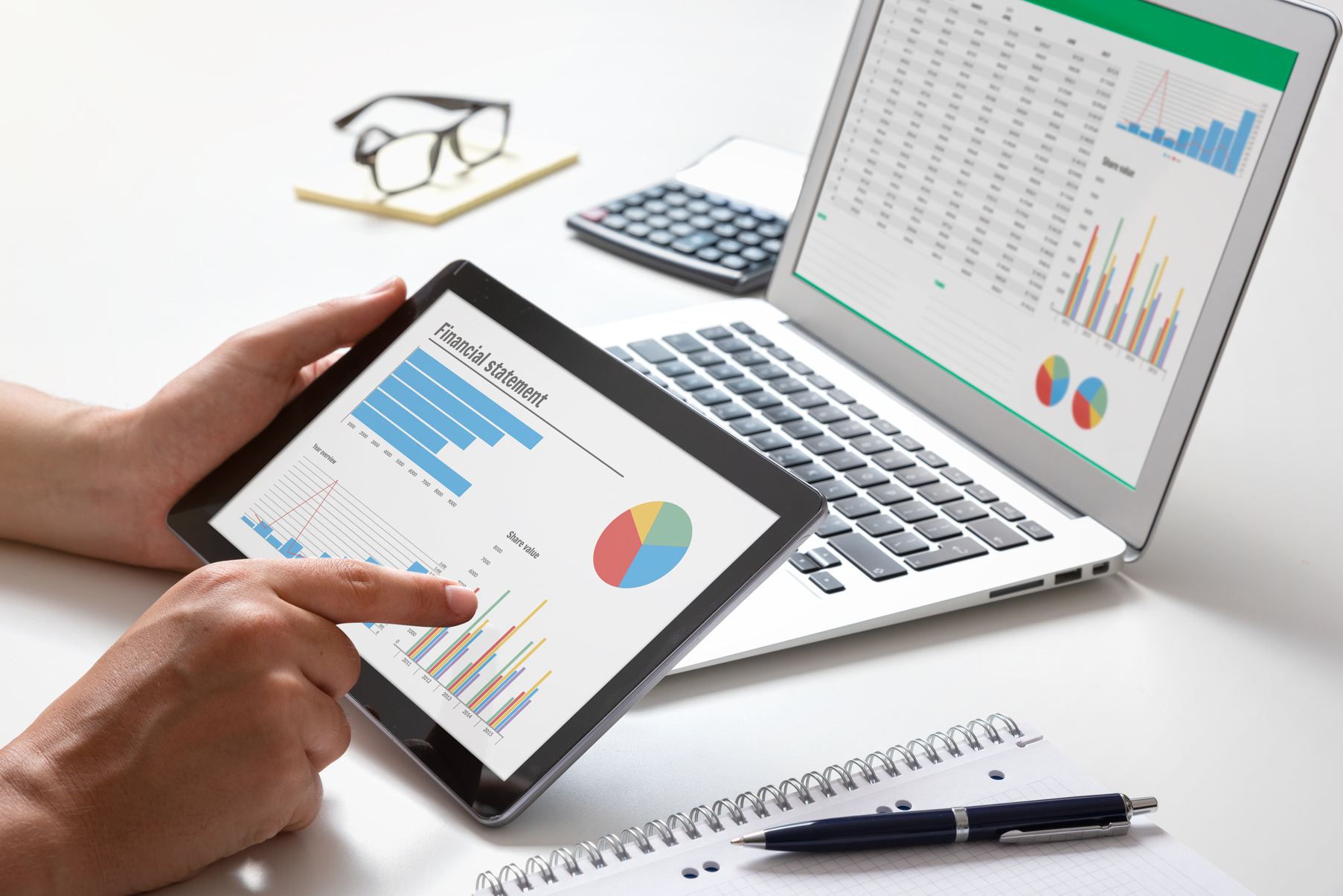 Analyst Works with the Data and Graphs on Screen